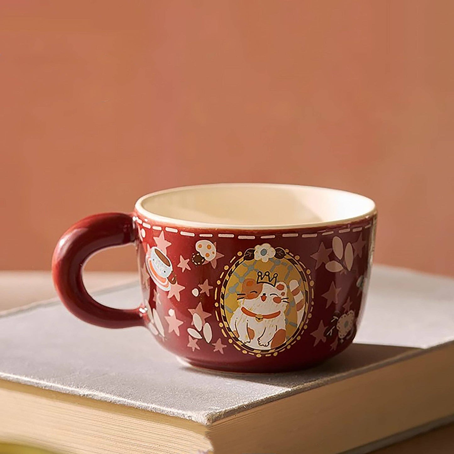 Ceramic mug with cat illustration