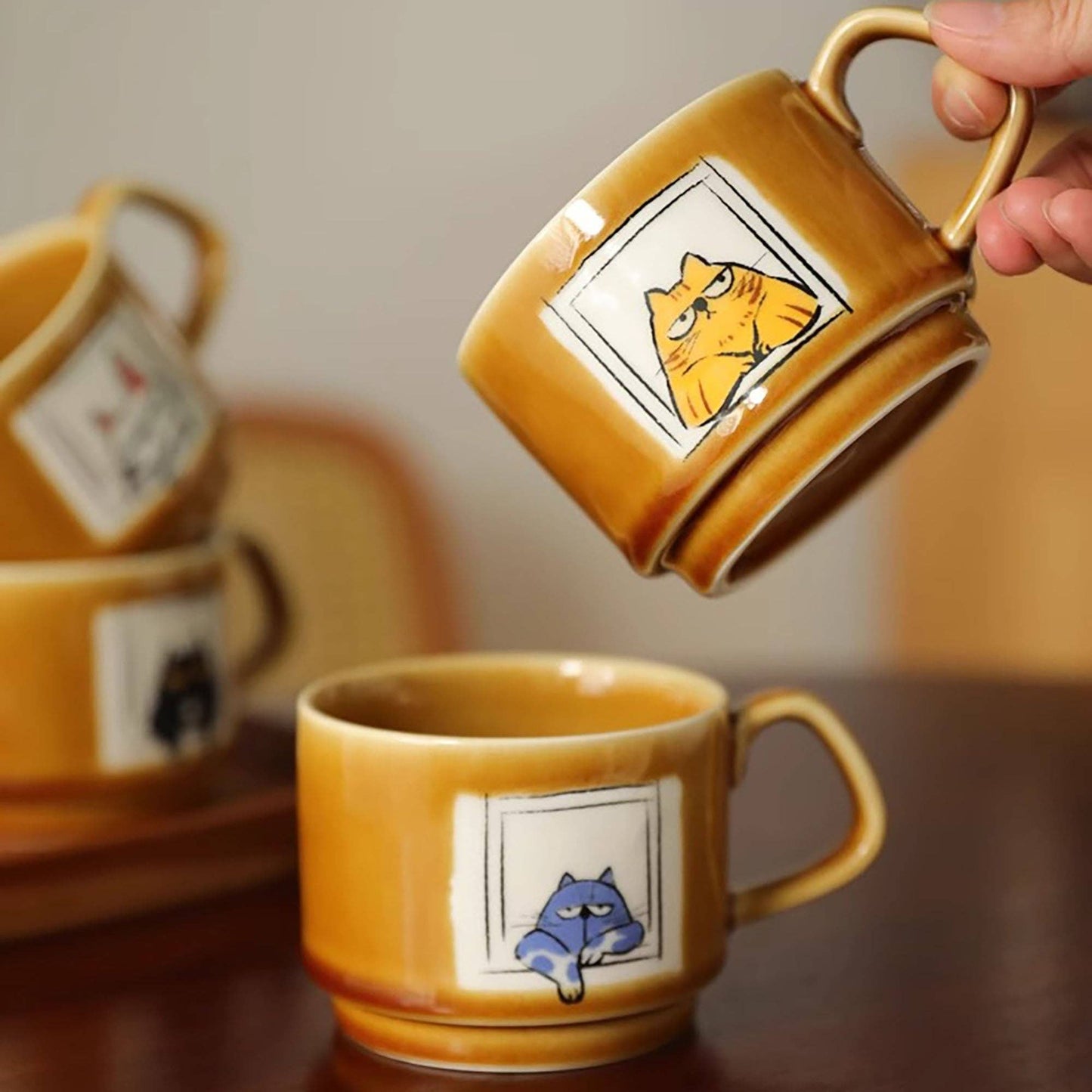 Ceramic coffee mug with cat illustration