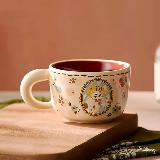 Ceramic mug with cat illustration