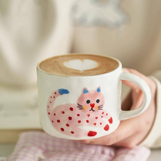Handmade ceramic mug with pink cat design